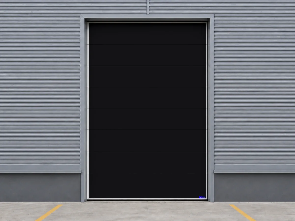 Porte sectionnelle industrielle noire pour un atelier