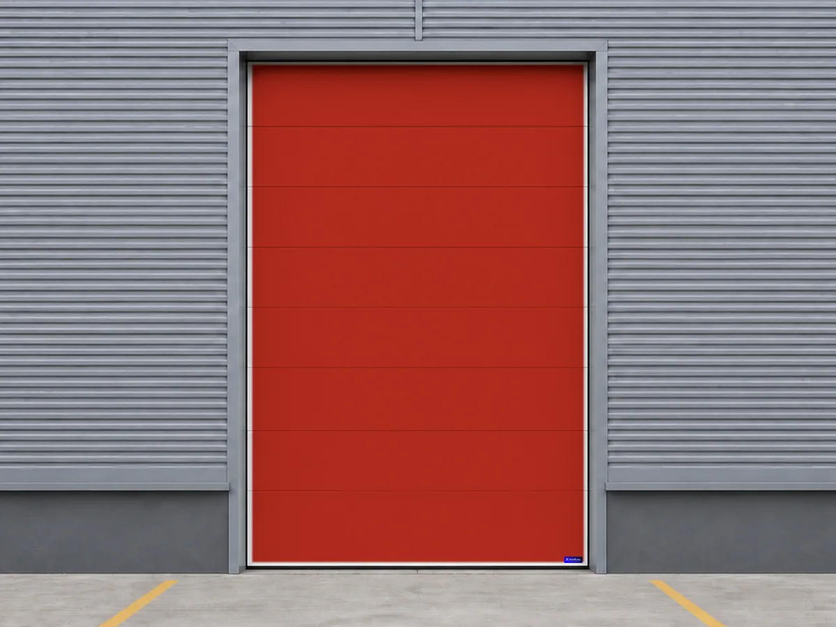 Porte sectionnelle industrielle rouge pour un bâtiment agricole